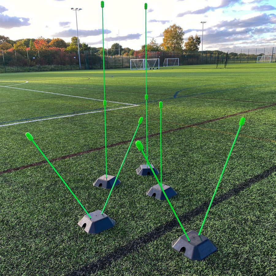 Base Weight set of 2 for KICKSTER, SPOT and agility poles: black base weights with green poles set up at different heights on an artificial pitch.