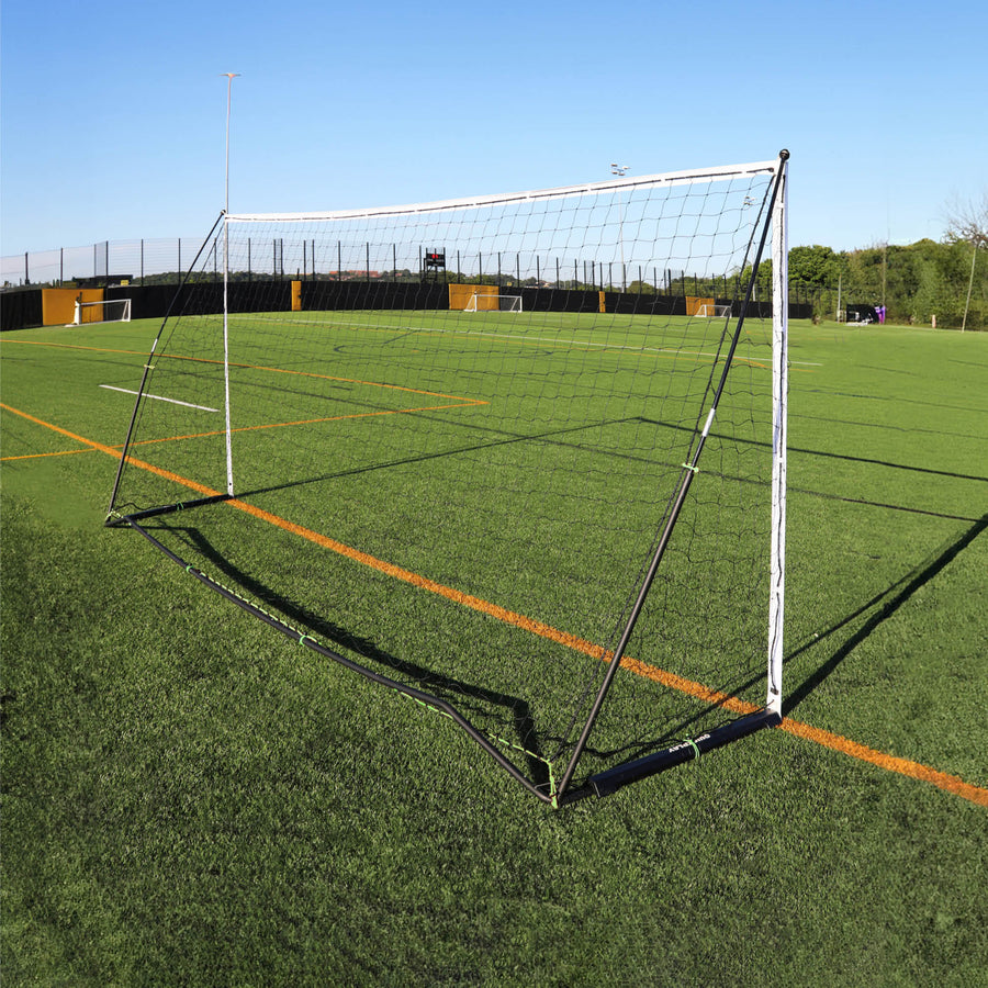 KICKSTER Elite 500 x 200 cm goal from behind on an artificial pitch, showing the black back frame and the net.