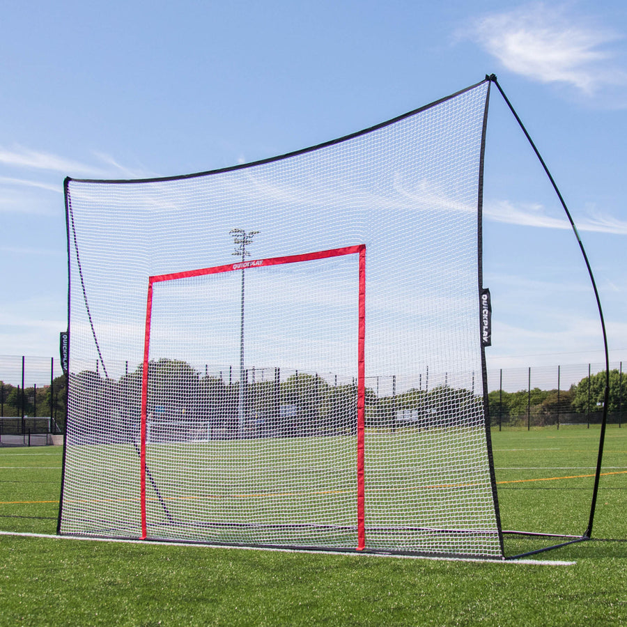 MEGA NET 370 x 270 cm ball-stop on an artificial pitch, with an orange target frame hanging inside the white net.