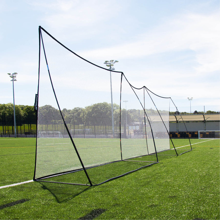 MEGA NET 370 x 270 cm ball-stop set up in a long row with a second net along the edge of an artificial pitch.