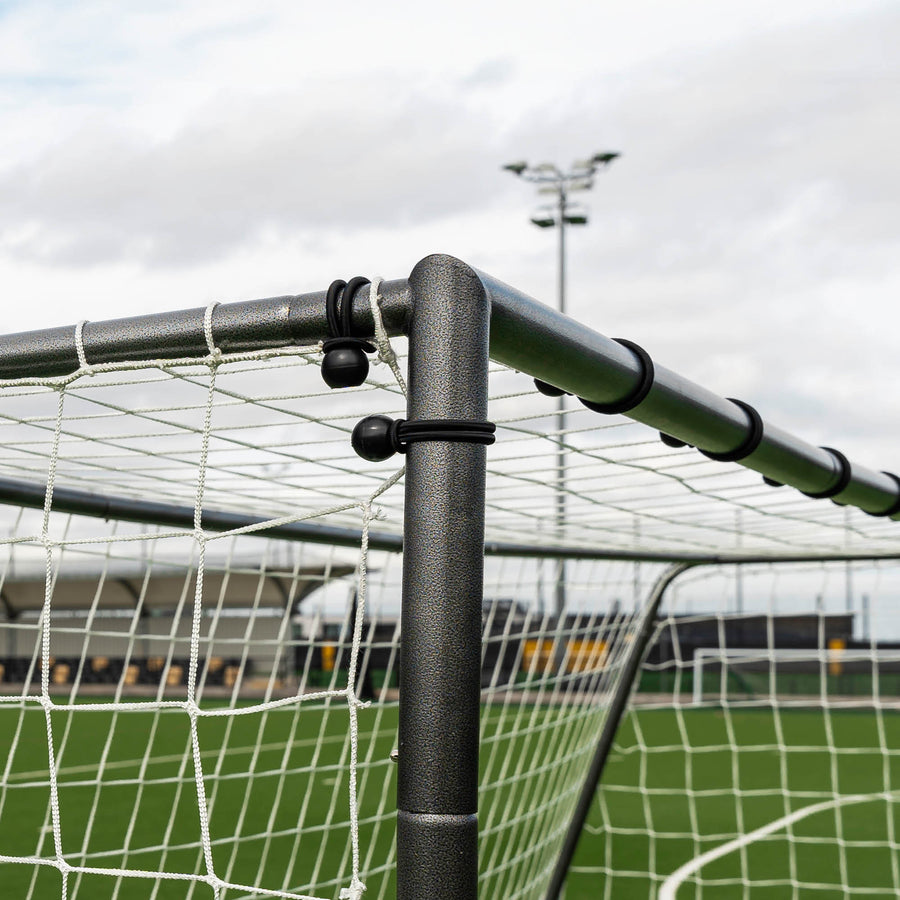 GS Series Futsal Goal 300 x 200 cm close-up of a top corner, with black ball bungees holding the white net to the frame.