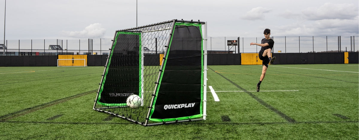 a player practicing on a TEKKERS GS Trainer 3-in-1 goal and rebounder.